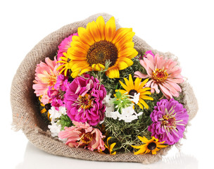 Beautiful bouquet of bright flowers in sacking isolated on