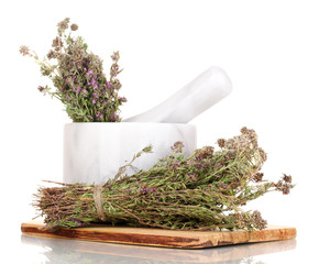 Thyme herb and mortar isolated on white