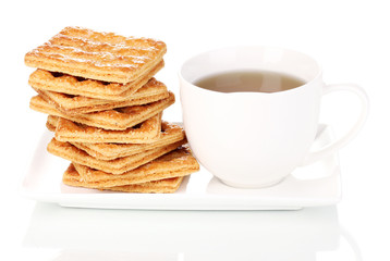 Cup of tea and cookies isolated on white