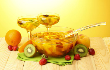 punch in bowl and glasses with fruits,