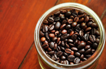 Fototapeta premium close up coffe berry in bottle