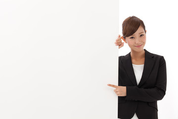 a young businesswoman with blank whiteboard