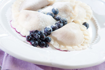 Pierogi with blueberries, traditional polish dish