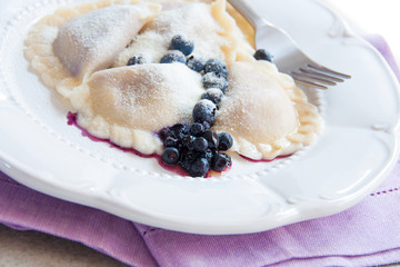 Pierogi with blueberries, traditional polish dish