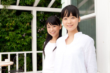 Obraz premium Beautiful young women outside the house Portrait of asian.