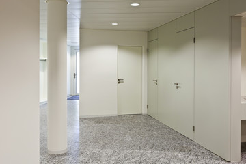 building interior, granite floor, white wall