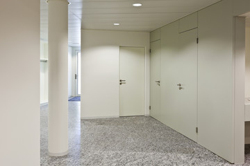 building interior, granite floor, white wall