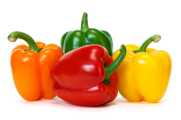 colored peppers over white background