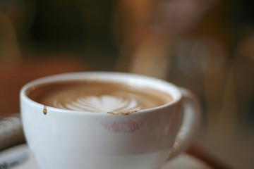 Coffee Cup with Latte Art and Lipstick Print