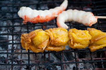 grilling meat ball on stick