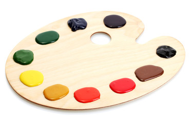wooden art palette with paint isolated on white