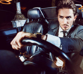 Beauty stylish guy in  car .