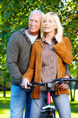 Happy senior couple cyclist.