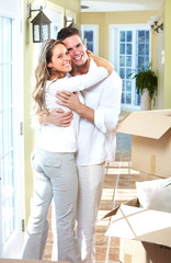 Happy couple moving in a new house.