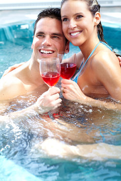 Young couple in jacuzzi.
