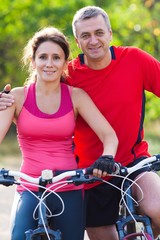 mature couple on  bicycle
