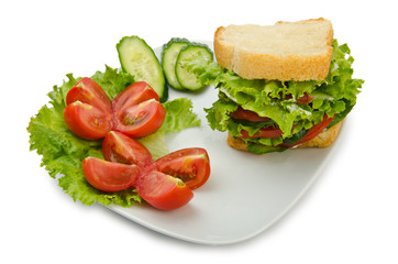 Tomatoes and cucumbers on white