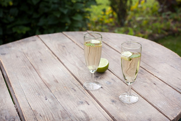 Champagne glasses with sirup and peppermint leaf