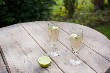 Champagne glasses with sirup and peppermint coctail hugo