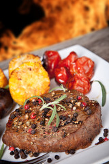 delicious grilled steak with vegetable on wooden table