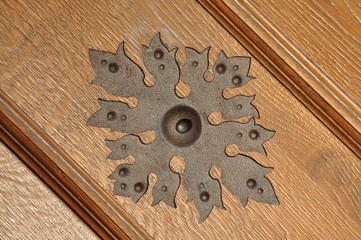 Steel ornament on wooden door