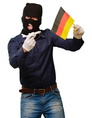 Man wearing a robber mask and holding airplane miniature and fla