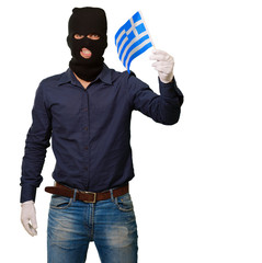 Man wearing robber mask and holding flag