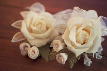 Two wedding boutonnieres of roses