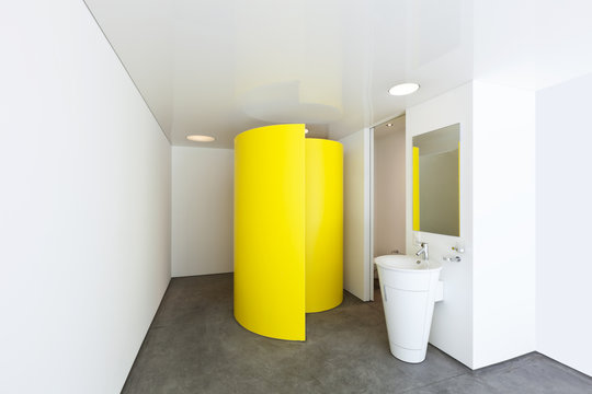 Bathroom with a colored shower cubicle in hotel