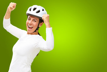 Woman wearing helmet cheering