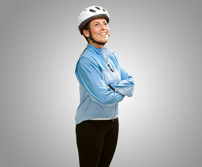 Women smiling with hands folded