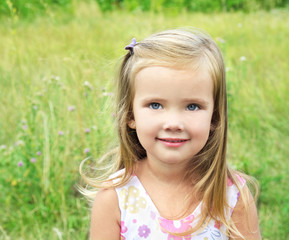 Cute little girl on the meadow