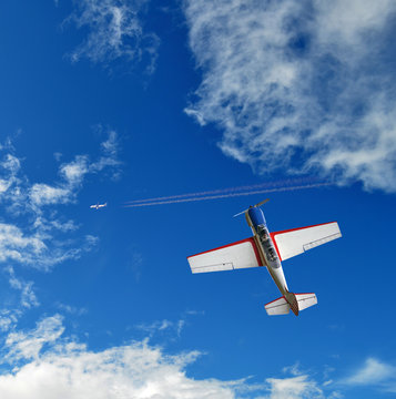 Aerobatic airplane in the blue sky