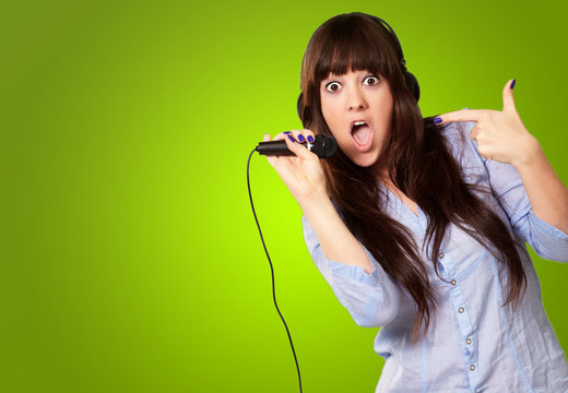 Portrait Of A Young Female With A Mike