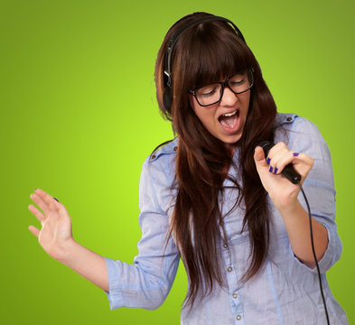 Portrait Of A Young Female With A Mike