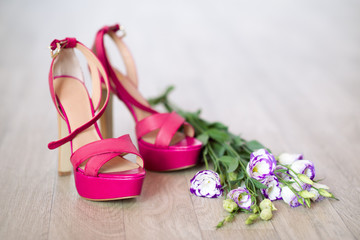Fototapeta na wymiar PInk fashion high heels and flowers