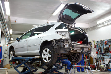Car is lifted in car body repair service - 44197504