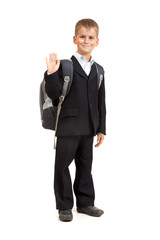 Schoolboy sitting on books