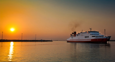 view of passenger ferry boat in open waters in Greece at sunrise