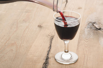 Red wine being poured from decanter