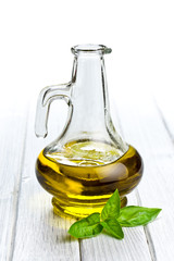 olive oil with basil leaves