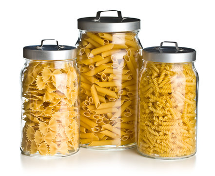 various raw pasta in glass jar