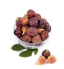 Bowl of ripe figs isolated on white background