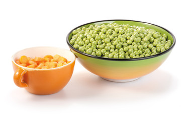 Carrots and peas in bowls