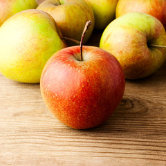 red apples on wooden table