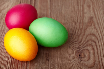 Painted Easter Eggs on wooden background