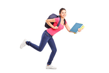 Full length portrait of a college student in a hurry running wit