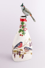 Bird on a decoupage bottle