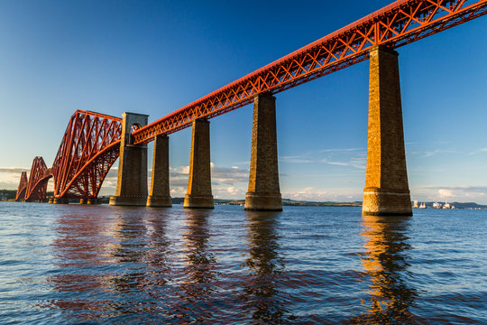Fototapeta Old steel bridge in Scotland at sunset