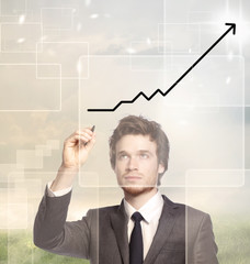 Businessman drawing a graph -growth